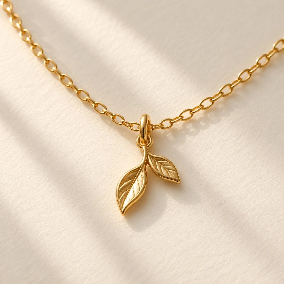 Futaba Leaf Necklace: close-up of the Gold pendant