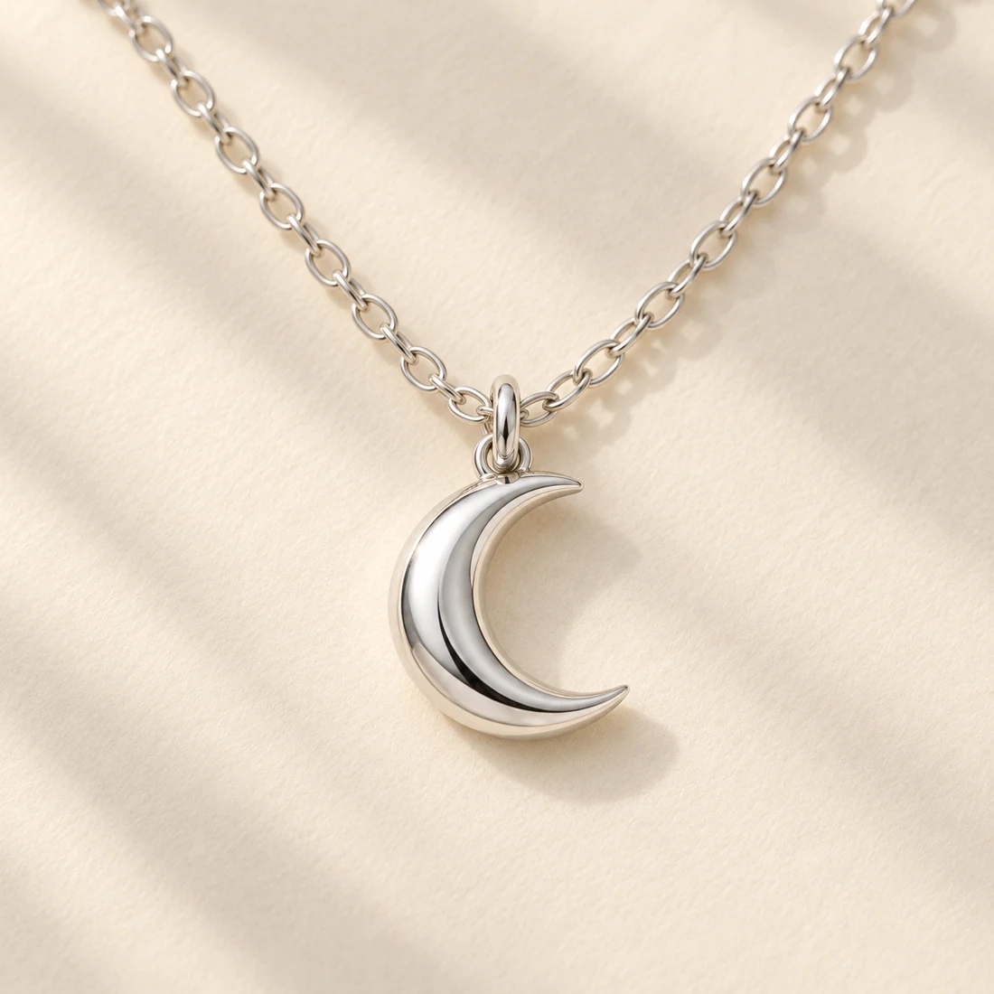 Tsuki Crescent Necklace: close-up of the Silver pendant